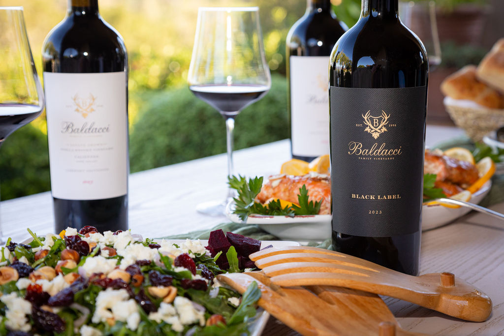 The 2023 Cabernets on the table where they are meant to end up, poured and shared over a meal.